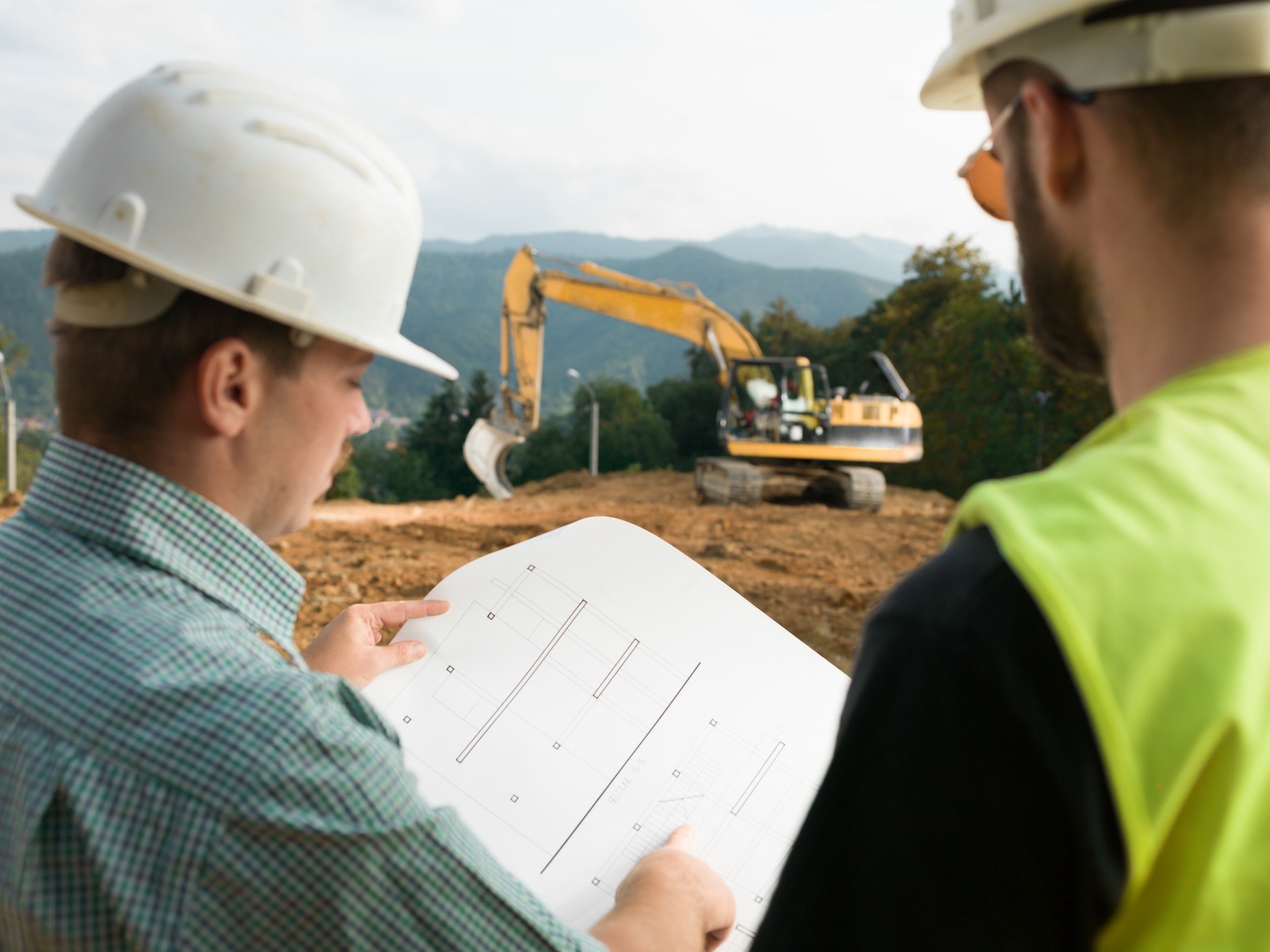 contractors reading construction plans